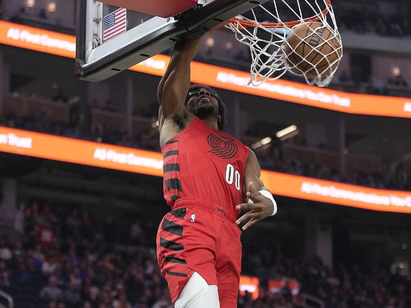 SAN FRANCISCO, CALIFORNIA - DECEMBER 23: Scoot Henderson #00 of the Portland Trail Blazers slam dunks during the first half against the Golden State Warriors at Chase Center on December 23, 2023 in San Francisco, California. NOTE TO USER: User expressly acknowledges and agrees that, by downloading and or using this photograph, User is consenting to the terms and conditions of the Getty Images License Agreement. (Photo by Thearon W. Henderson/Getty Images)