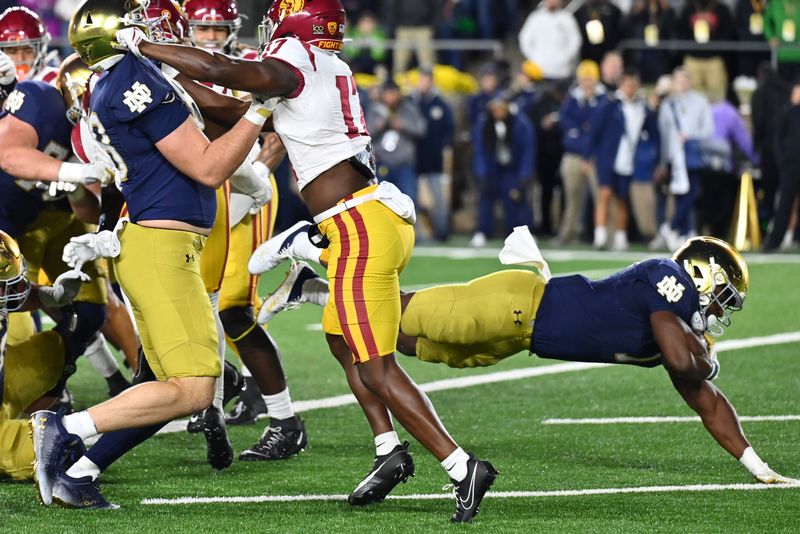 Oct 14, 2023; South Bend, Indiana, USA; Notre Dame Fighting Irish running back Audric Estime (7) scores a touchdown in the second quarter against the USC Trojans at Notre Dame Stadium. Mandatory Credit: Matt Cashore-USA TODAY Sports