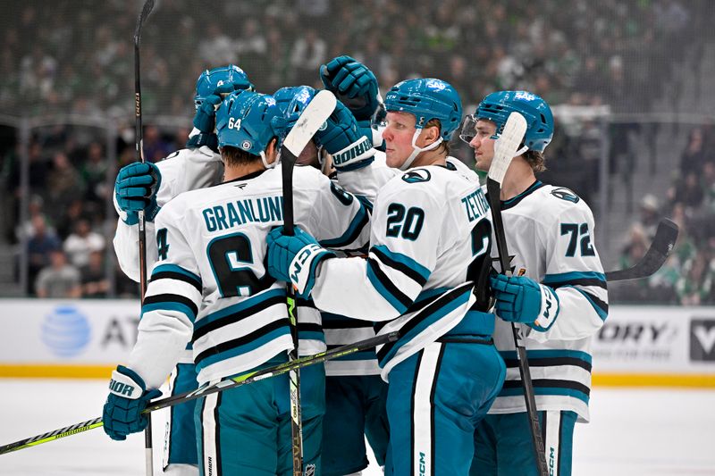Nov 20, 2024; Dallas, Texas, USA; San Jose Sharks center Mikael Granlund (64) and left wing Fabian Zetterlund (20) and left wing William Eklund (72) and defenseman Jake Walman (96) celebrates a goal scored by Walman against the Dallas Stars during the third period at the American Airlines Center. Mandatory Credit: Jerome Miron-Imagn Images