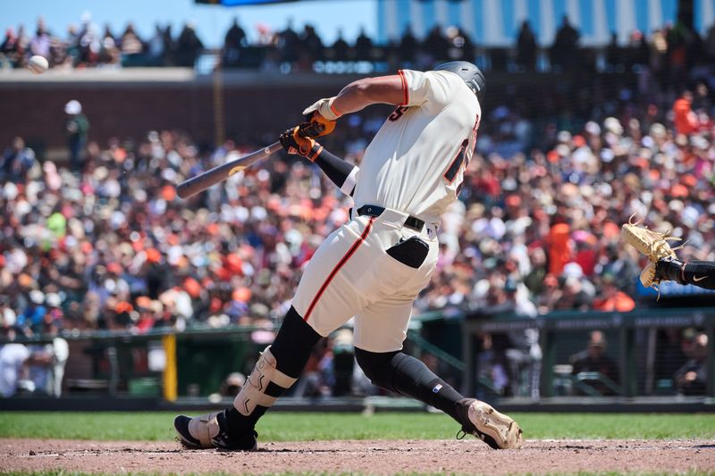 May 19, 2024; San Francisco, California, USA; San Francisco Giants outfielder Heliot Ramos (17) hits a one run home run against the Colorado Rockies during the sixth inning at Oracle Park. Mandatory Credit: Robert Edwards-USA TODAY Sports