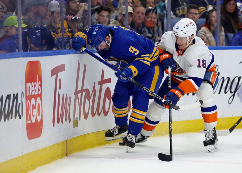 Mar 14, 2024; Buffalo, New York, USA;  Buffalo Sabres left wing Zach Benson (9) and New York Islanders left wing Pierre Engvall (18) go after a loose puck during the second period at KeyBank Center. Mandatory Credit: Timothy T. Ludwig-USA TODAY Sports