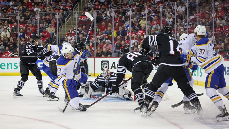 Oct 27, 2023; Newark, New Jersey, USA; New Jersey Devils goaltender Vitek Vanecek (41) makes a save as Buffalo Sabres left wing Jeff Skinner (53) battles with defenseman Kevin Bahl (88) during the second period at Prudential Center. Mandatory Credit: Vincent Carchietta-USA TODAY Sports