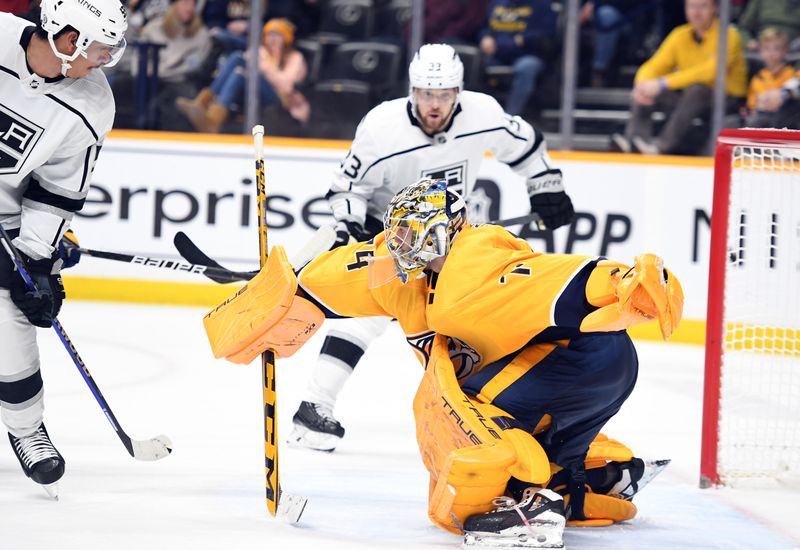 Jan 21, 2023; Nashville, Tennessee, USA; Nashville Predators goaltender Juuse Saros (74) makes a save during the second period against the Los Angeles Kings at Bridgestone Arena. Mandatory Credit: Christopher Hanewinckel-USA TODAY Sports