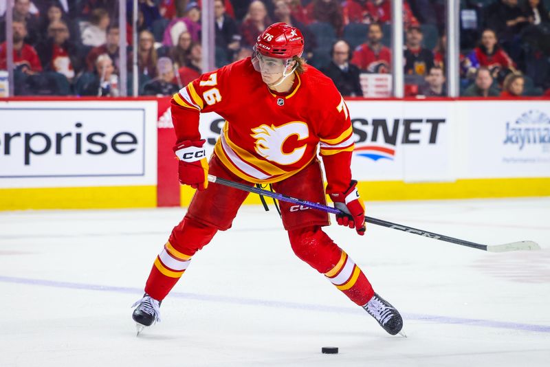 Mar 4, 2024; Calgary, Alberta, CAN; Calgary Flames center Martin Pospisil (76) shoots the puck against the Seattle Kraken during the second period at Scotiabank Saddledome. Mandatory Credit: Sergei Belski-USA TODAY Sports