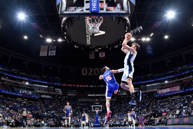 ORLANDO, FL - OCTOBER 18: Franz Wagner #22 of the Orlando Magic makes a buzzer beater shot during the game against the Philadelphia 76ers during a NBA preseason game on October 18, 2024 at Kia Center in Orlando, Florida. NOTE TO USER: User expressly acknowledges and agrees that, by downloading and or using this photograph, User is consenting to the terms and conditions of the Getty Images License Agreement. Mandatory Copyright Notice: Copyright 2024 NBAE (Photo by Fernando Medina/NBAE via Getty Images)