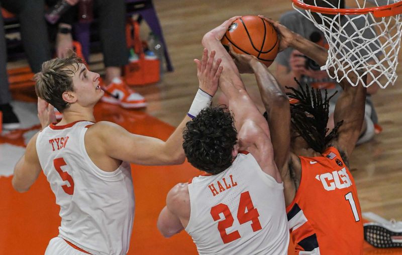 Feb 22, 2023; Clemson, South Carolina, USA; Clemson forward PJ Hall (24) blocks the shot of Syracuse forward Maliq Brown (1) during the first half at Littlejohn Coliseum. Mandatory Credit: Ken Ruinard-USA TODAY Sports