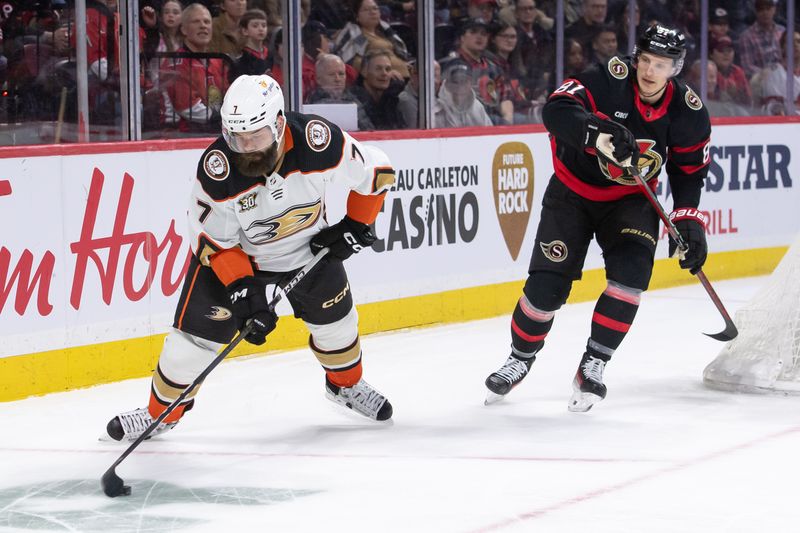 Feb 15, 2024; Ottawa, Ontario, CAN; Anaheim Ducks defenseman Radko Gudas (7) clears the puck Ottawa Senators away from Dominik Kubalik (81) in the first period at the Canadian Tire Centre. Mandatory Credit: Marc DesRosiers-USA TODAY Sports