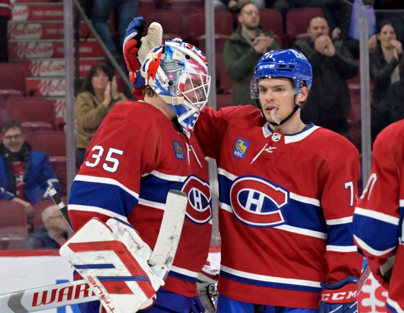 Apr 2, 2024; Montreal, Quebec, CAN; Montreal Canadiens goalie Sam Montembeault (35) celebrates the win against the Florida Panthers with teammate forward Jake Evans (71) at the Bell Centre. Mandatory Credit: Eric Bolte-USA TODAY Sports