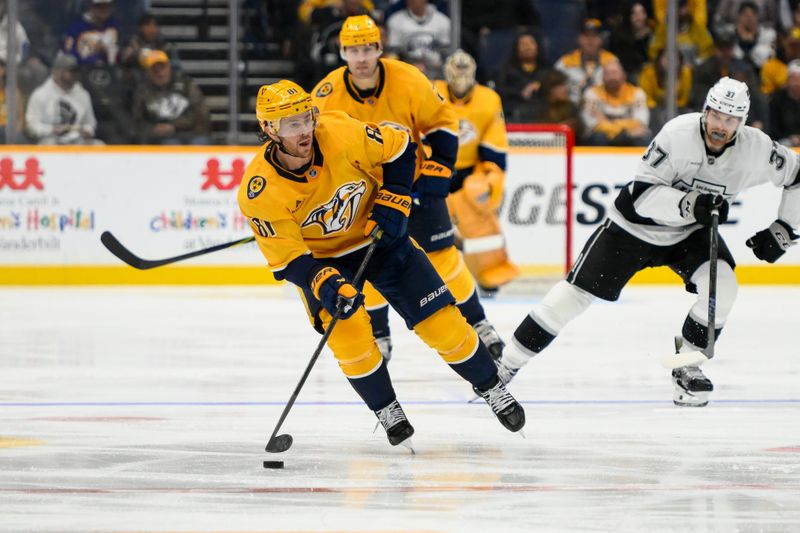 Nov 4, 2024; Nashville, Tennessee, USA;  Nashville Predators center Jonathan Marchessault (81) passes the puck against the Los Angeles Kings during the third period at Bridgestone Arena. Mandatory Credit: Steve Roberts-Imagn Images