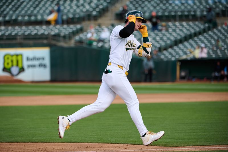 May 4, 2024; Oakland, California, USA; Oakland Athletics designated hitter Brent Rooker (25) gestures toward the against the Oakland Athletics dugout after hitting a two-run home run against the Miami Marlins during the third inning at Oakland-Alameda County Coliseum. Mandatory Credit: Robert Edwards-USA TODAY Sports