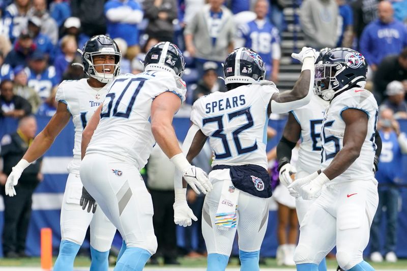 Tennessee Titans running back Tyjae Spears (32) celebrates his 19-yard touchdown run with teammates during the second half of an NFL football game against the Indianapolis Colts, Sunday, Oct. 8, 2023, in Indianapolis. (AP Photo/Michael Conroy)