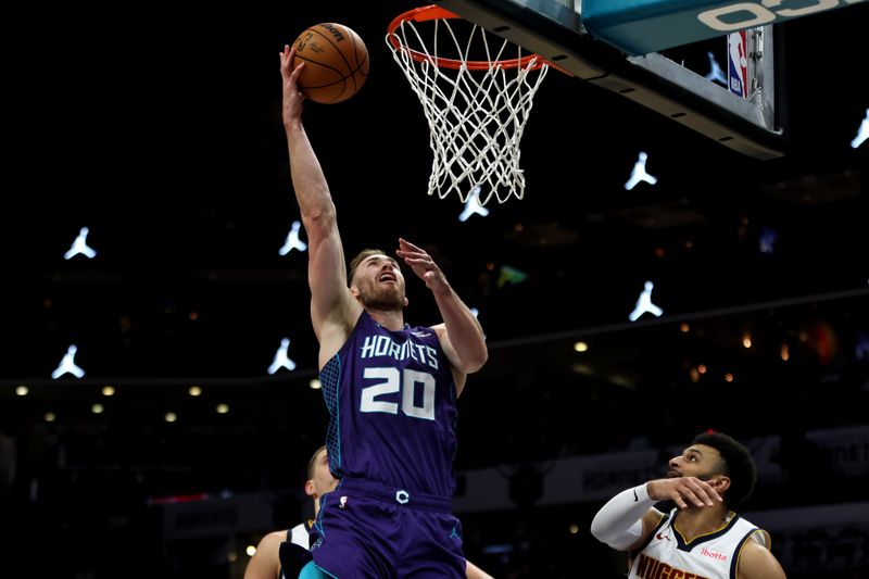 CHARLOTTE, NORTH CAROLINA - DECEMBER 23: Gordon Hayward #20 of the Charlotte Hornets lays the ball up during the first half of an NBA game against the Denver Nuggets at Spectrum Center on December 23, 2023 in Charlotte, North Carolina. NOTE TO USER: User expressly acknowledges and agrees that, by downloading and or using this photograph, User is consenting to the terms and conditions of the Getty Images License Agreement. (Photo by David Jensen/Getty Images)