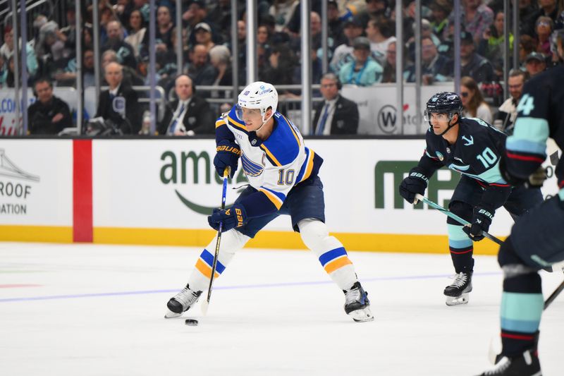 Apr 12, 2025; Seattle, Washington, USA; St. Louis Blues center Brayden Schenn (10) plays the puck during the third period against the Seattle Kraken at Climate Pledge Arena. Mandatory Credit: Steven Bisig-Imagn Images