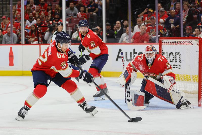 Apr 21, 2024; Sunrise, Florida, USA; Florida Panthers defenseman Brandon Montour (62) moves the puck against the Tampa Bay Lightning during the second period in game one of the first round of the 2024 Stanley Cup Playoffs at Amerant Bank Arena. Mandatory Credit: Sam Navarro-USA TODAY Sports