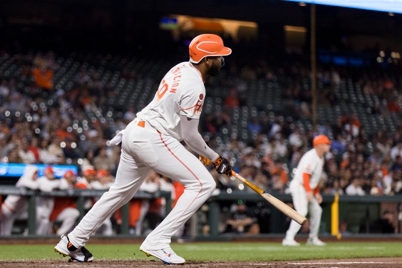 Sep 3, 2024; San Francisco, California, USA;  San Francisco Giants designated hitter Jerar Encarnacion (59) hits an RBI single against the Arizona Diamondbacks during the eighth inning at Oracle Park. Mandatory Credit: John Hefti-Imagn Images