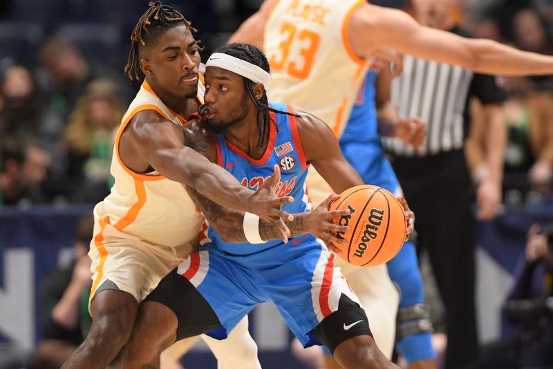 Mar 9, 2023; Nashville, TN, USA;  Tennessee Volunteers guard B.J. Edwards (1) guards Mississippi Rebels guard Amaree Abram (1) during the second half at Bridgestone Arena. Mandatory Credit: Steve Roberts-USA TODAY Sports