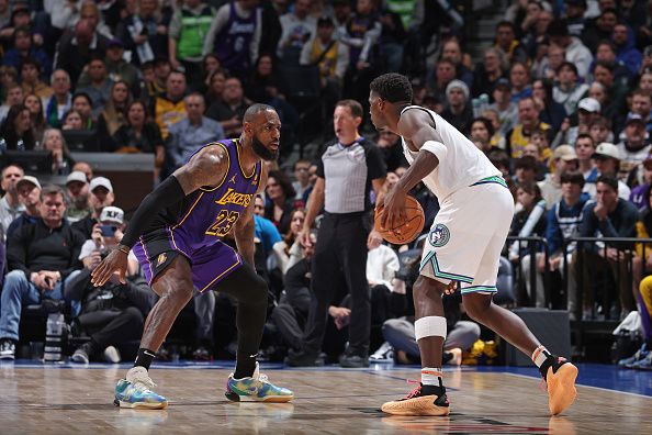 MINNEAPOLIS, MN -  DECEMBER 30: LeBron James #23 of the Los Angeles Lakers plays defense against Anthony Edwards #5 of the Minnesota Timberwolves during the game on December 30, 2023 at Target Center in Minneapolis, Minnesota. NOTE TO USER: User expressly acknowledges and agrees that, by downloading and or using this Photograph, user is consenting to the terms and conditions of the Getty Images License Agreement. Mandatory Copyright Notice: Copyright 2023 NBAE (Photo by David Sherman/NBAE via Getty Images)