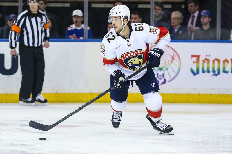 Mar 4, 2024; New York, New York, USA;  Florida Panthers defenseman Brandon Montour (62) controls the puck in the third period against the New York Rangers at Madison Square Garden. Mandatory Credit: Wendell Cruz-USA TODAY Sports