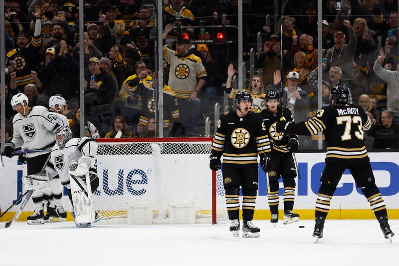 Feb 17, 2024; Boston, Massachusetts, USA; Boston Bruins center Anthony Richard (90) celebrates his goal against the Los Angeles Kings with defenseman Charlie McAvoy (73) during the second period at TD Garden. Mandatory Credit: Winslow Townson-USA TODAY Sports