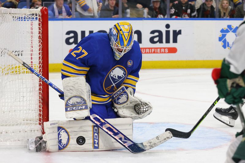 Nov 10, 2023; Buffalo, New York, USA;  Buffalo Sabres goaltender Devon Levi (27) makes a save during the third period against the Minnesota Wild at KeyBank Center. Mandatory Credit: Timothy T. Ludwig-USA TODAY Sports