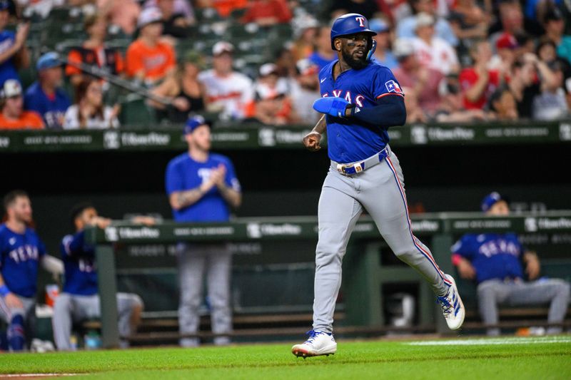 Jun 30, 2024; Baltimore, Maryland, USA; Texas Rangers outfielder Adolis García (53) scores a run during the fifth inning against the Baltimore Orioles at Oriole Park at Camden Yards. Mandatory Credit: Reggie Hildred-USA TODAY Sports