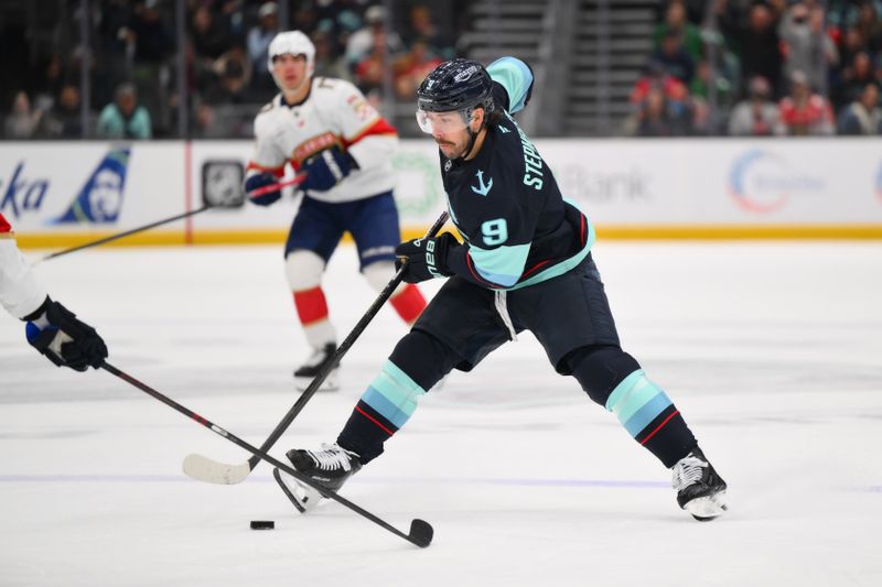 Mar 15, 2026; Seattle, Washington, USA; Seattle Kraken center Chandler Stephenson (9) passes the puck against the Florida Panthers during the third period at Climate Pledge Arena. Mandatory Credit: Steven Bisig-Imagn Images