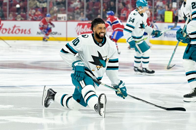 Jan 11, 2024; Montreal, Quebec, CAN; San Jose Sharks forward Anthony Duclair (10) stretches during the warmup period before the game against the Montreal Canadiens at the Bell Centre. Mandatory Credit: Eric Bolte-USA TODAY Sports