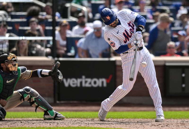 Jun 16, 2024; New York City, New York, USA; New York Mets designated hitter J.D. Martinez (28) hits a single against the San Diego Padres during the seventh inning at Citi Field. Mandatory Credit: John Jones-USA TODAY Sports