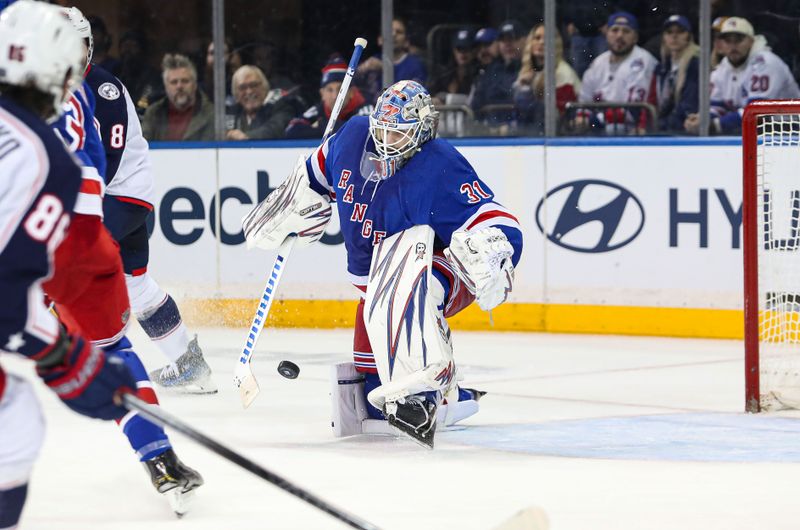 Jan 18, 2025; New York, New York, USA; New York Rangers goalie Igor Shesterkin (31) makes a save against the Columbus Blue Jackets during overtime at Madison Square Garden. Mandatory Credit: Danny Wild-Imagn Images