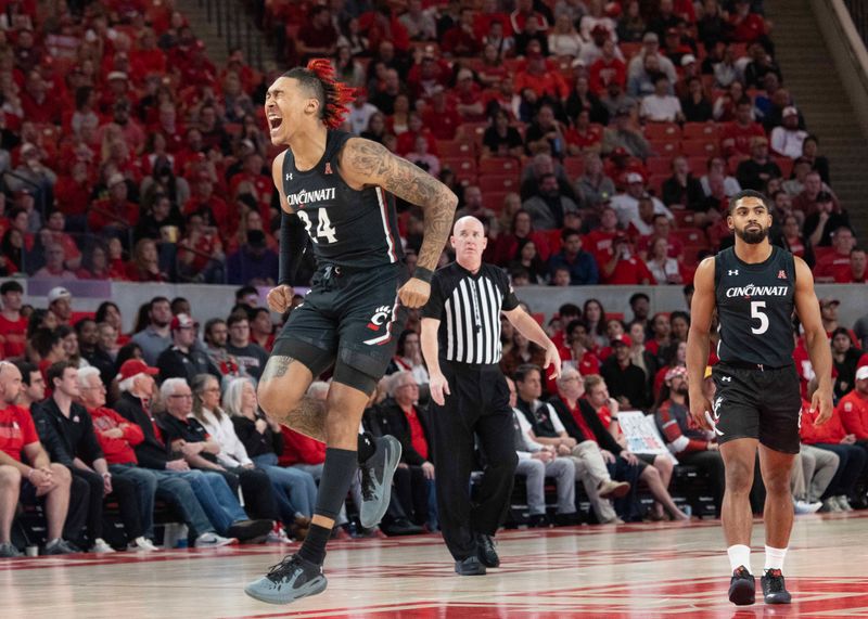 Jan 28, 2023; Houston, Texas, USA;Cincinnati Bearcats guard Jeremiah Davenport (24) celebrates his three point basket against the Houston Cougars in the first half at Fertitta Center. Mandatory Credit: Thomas Shea-USA TODAY Sports