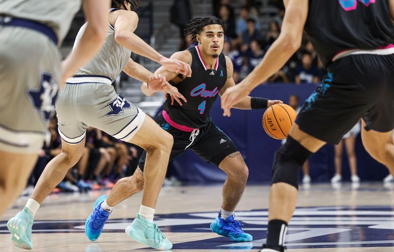 Jan 24, 2024; Houston, Texas, USA; Florida Atlantic Owls guard Bryan Greenlee (4) controls the ball during the first half against the Rice Owls at Tudor Fieldhouse. Mandatory Credit: Troy Taormina-USA TODAY Sports