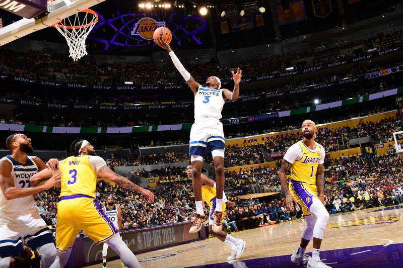 LOS ANGELES, CA - OCTOBER 22: Jaden McDaniels #3 of the Minnesota Timberwolves drives to the basket during the game against the Los Angeles Lakers on October 22, 2024 at Crypto.Com Arena in Los Angeles, California. NOTE TO USER: User expressly acknowledges and agrees that, by downloading and/or using this Photograph, user is consenting to the terms and conditions of the Getty Images License Agreement. Mandatory Copyright Notice: Copyright 2024 NBAE (Photo by Adam Pantozzi/NBAE via Getty Images)