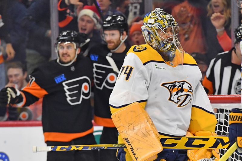 Dec 21, 2023; Philadelphia, Pennsylvania, USA; Nashville Predators goaltender Juuse Saros (74) reacts after allowing goal by Philadelphia Flyers center Sean Couturier (14) during the second period at Wells Fargo Center. Mandatory Credit: Eric Hartline-USA TODAY Sports