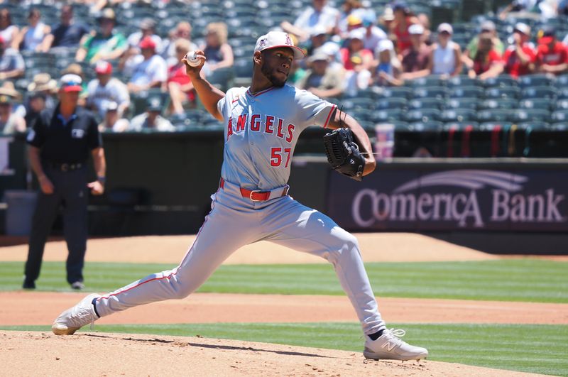 Jul 4, 2024; Oakland, California, USA; Los Angeles Angels starting pitcher Roansy Contreras (57) pitches the ball against the Oakland Athletics during the first inning at Oakland-Alameda County Coliseum. Mandatory Credit: Kelley L Cox-USA TODAY Sports