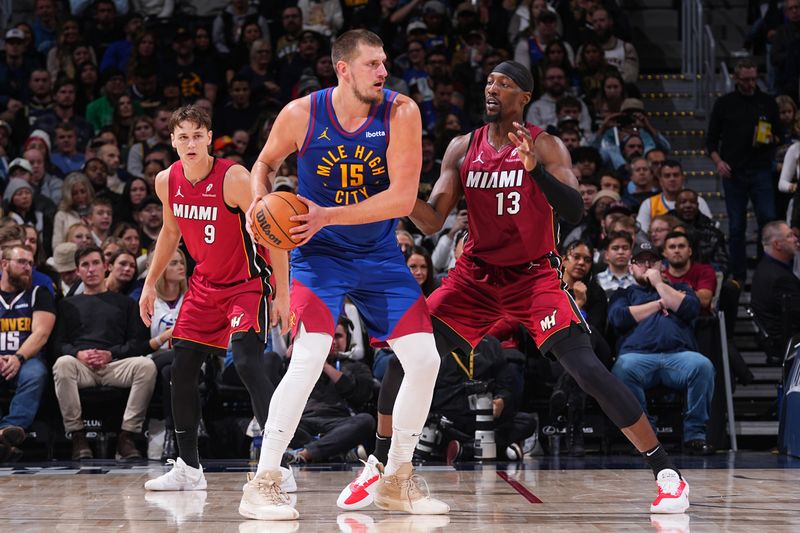 DENVER, CO - NOVEMBER 8: Nikola Jokic #15 of the Denver Nuggets looks to pass the ball during the game against the Miami Heat on November 8, 2024 at Ball Arena in Denver, Colorado. NOTE TO USER: User expressly acknowledges and agrees that, by downloading and/or using this Photograph, user is consenting to the terms and conditions of the Getty Images License Agreement. Mandatory Copyright Notice: Copyright 2024 NBAE (Photo by Bart Young/NBAE via Getty Images)