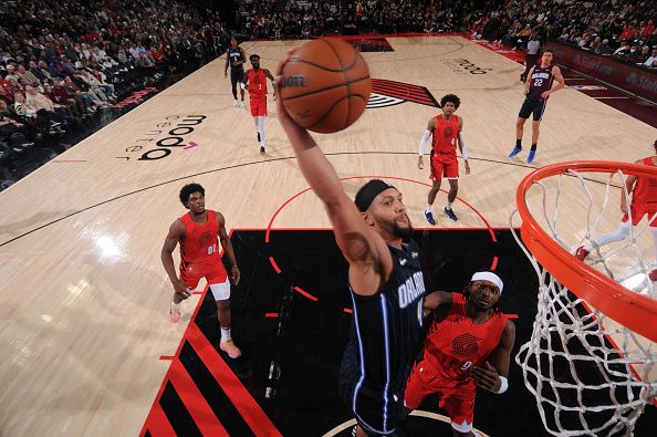 PORTLAND, OR - OCTOBER 27: Jalen Suggs #4 of the Orlando Magic dunks the ball during the game against the Portland Trail Blazers on October 27, 2023 at the Moda Center Arena in Portland, Oregon. NOTE TO USER: User expressly acknowledges and agrees that, by downloading and or using this photograph, user is consenting to the terms and conditions of the Getty Images License Agreement. Mandatory Copyright Notice: Copyright 2023 NBAE (Photo by Cameron Browne/NBAE via Getty Images)