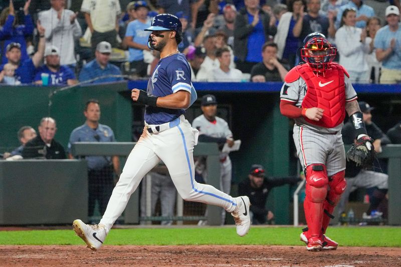 Sep 6, 2024; Kansas City, Missouri, USA; Kansas City Royals designated hitter MJ Melendez (1) scores as Minnesota Twins catcher Christian Vázquez (8) looks on in the fifth inning at Kauffman Stadium. Mandatory Credit: Denny Medley-Imagn Images