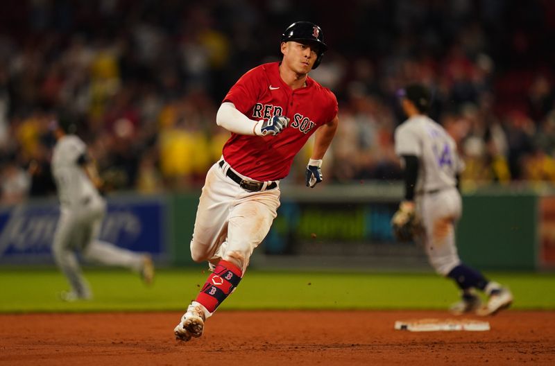 Jun 14, 2023; Boston, Massachusetts, USA; Boston Red Sox left fielder Rob Refsnyder (30) hits a triple to center field to drive in two runs against the Colorado Rockies in the seventh inning at Fenway Park. Mandatory Credit: David Butler II-USA TODAY Sports