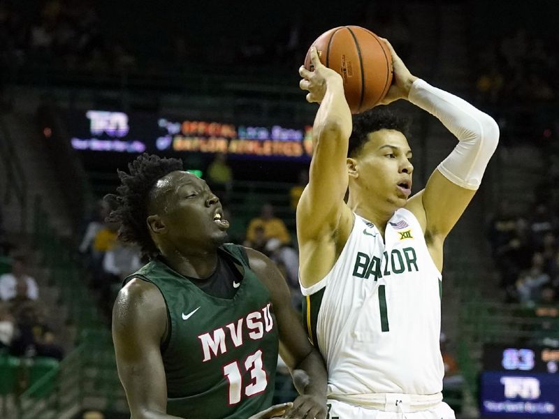 Dec 22, 2023; Waco, Texas, USA; Baylor Bears guard Miro Little (1) is guarded by Mississippi Valley State Delta Devils guard Darrius Clark (13) during the second half at Ferrell Center. Mandatory Credit: Raymond Carlin III-USA TODAY Sports