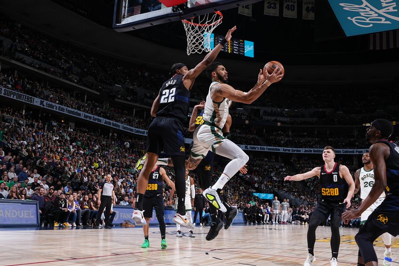 DENVER, CO - MARCH 7: Jayson Tatum #0 of the Boston Celtics drives to the basket during the game against the Denver Nuggets on March 7, 2024 at the Ball Arena in Denver, Colorado. NOTE TO USER: User expressly acknowledges and agrees that, by downloading and/or using this Photograph, user is consenting to the terms and conditions of the Getty Images License Agreement. Mandatory Copyright Notice: Copyright 2024 NBAE (Photo by Garrett Ellwood/NBAE via Getty Images)