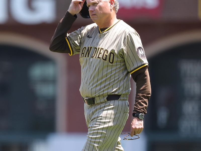 Jun 5, 2025; San Francisco, California, USA; San Diego Padres manager Mike Shildt (8) walks onto the field after the pitcher was hit by a San Francisco Giants single during the fifth inning at Oracle Park. Mandatory Credit: Kelley L Cox-Imagn Images