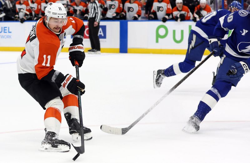 Nov 7, 2024; Tampa, Florida, USA; Philadelphia Flyers right wing Travis Konecny (11) skates with the puck against the Tampa Bay Lightning during overtime at Amalie Arena. Mandatory Credit: Kim Klement Neitzel-Imagn Images