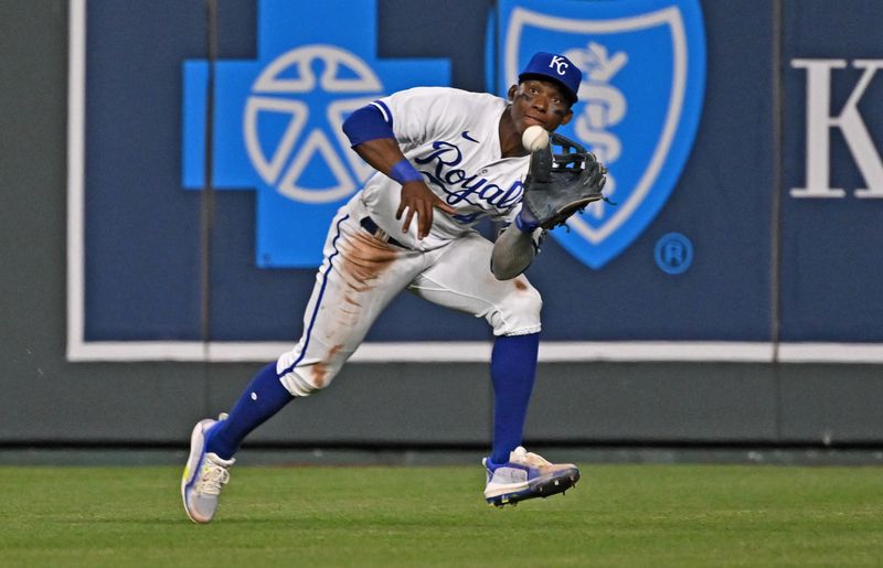 Jun 14, 2023; Kansas City, Missouri, USA;  Kansas City Royals center fielder Dairon Blanco (44) makes a running catch in the eighth inning against Cincinnati Reds at Kauffman Stadium. Mandatory Credit: Peter Aiken-USA TODAY Sports