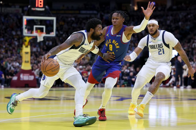 DENVER, COLORADO - NOVEMBER 22: Kyrie Irving #11 of the Dallas Mavericks drives against Peyton Watson #8 of the Denver Nuggets in the first quarter of the Emirates NBA Cup at Ball Arena on November 22, 2024 in Denver, Colorado. NOTE TO USER: User expressly acknowledges and agrees that, by downloading and or using this photograph, User is consenting to the terms and conditions of the Getty Images License Agreement.  (Photo by Matthew Stockman/Getty Images)