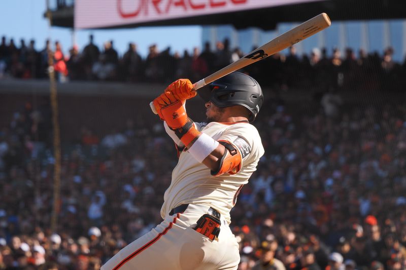 Apr 5, 2024; San Francisco, California, USA; San Francisco Giants second baseman Thairo Estrada (39) hits an RBI double during the ninth inning at Oracle Park. Mandatory Credit: Kelley L Cox-USA TODAY Sports