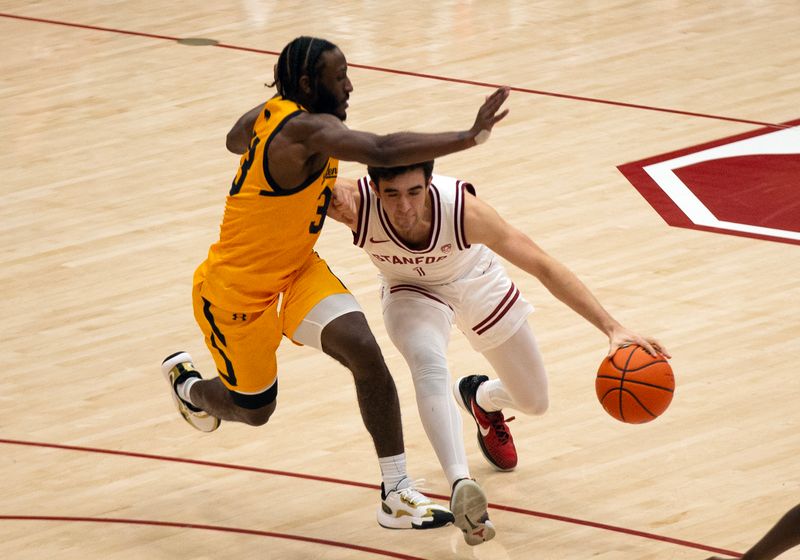 Jan 28, 2023; Stanford, California, USA; Stanford Cardinal guard Isa Silva (1) drives around California Golden Bears guard DeJuan Clayton (33) during the second half at Maples Pavilion. Stanford defeated California 75-46. Mandatory Credit: D. Ross Cameron-USA TODAY Sports