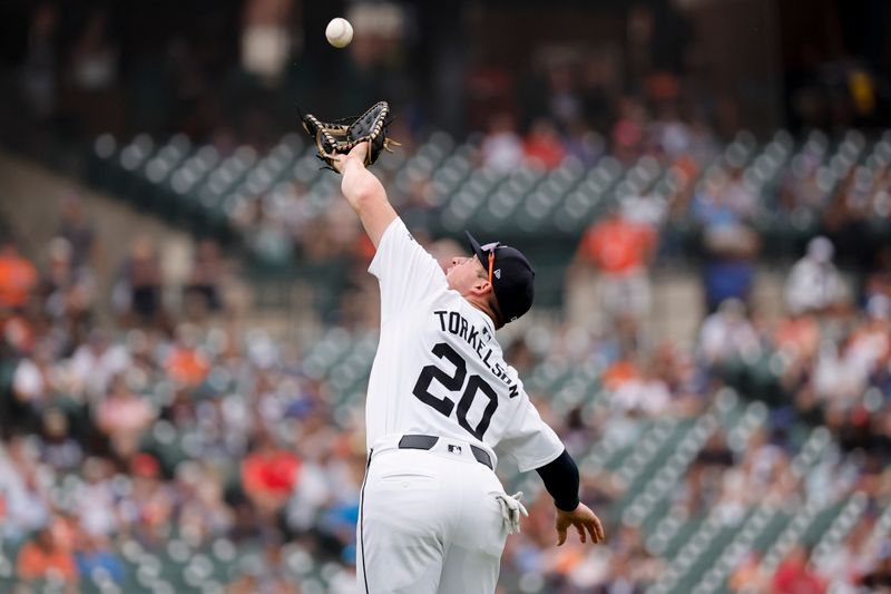 Aug 29, 2024; Detroit, Michigan, USA;  Detroit Tigers first base Spencer Torkelson (20) makes a catch in the seventh inning against the Los Angeles Angels at Comerica Park. Mandatory Credit: Rick Osentoski-USA TODAY Sports