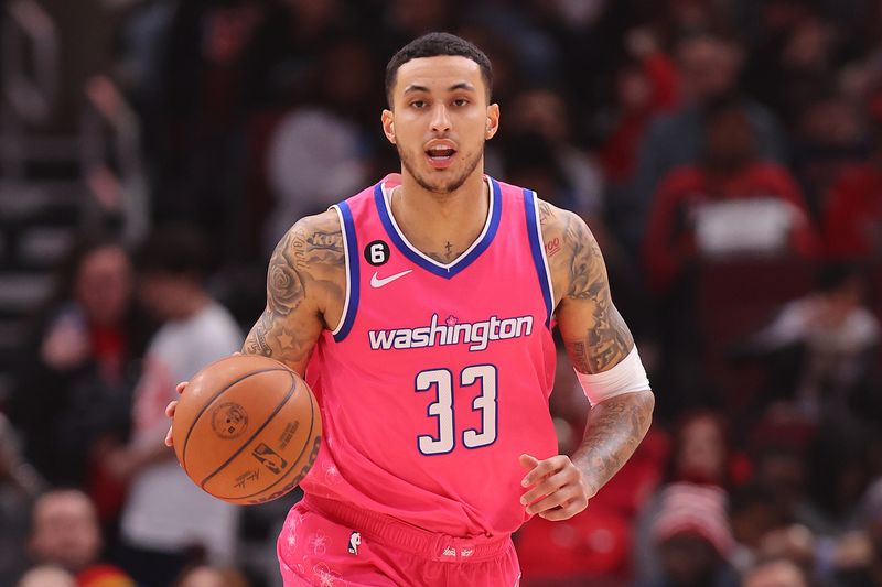 CHICAGO, ILLINOIS - FEBRUARY 26: Kyle Kuzma #33 of the Washington Wizards dribbles up the court against the Chicago Bulls during the first half at United Center on February 26, 2023 in Chicago, Illinois. NOTE TO USER: User expressly acknowledges and agrees that, by downloading and or using this photograph, User is consenting to the terms and conditions of the Getty Images License Agreement.  (Photo by Michael Reaves/Getty Images)