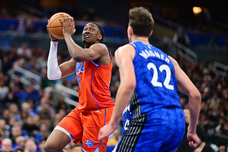 ORLANDO, FLORIDA - FEBRUARY 13: Jalen Williams #8 of the Oklahoma City Thunder shoots the ball against Franz Wagner #22 of the Orlando Magic in the second half at Kia Center on February 13, 2024 in Orlando, Florida. NOTE TO USER: User expressly acknowledges and agrees that, by downloading and or using this photograph, User is consenting to the terms and conditions of the Getty Images License Agreement. (Photo by Julio Aguilar/Getty Images)