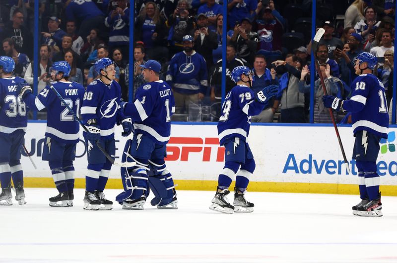 Feb 9, 2023; Tampa, Florida, USA; Tampa Bay Lightning center Vladislav Namestnikov (90), center Ross Colton (79) and teammates celebrate after they beat the Colorado Avalanche at Amalie Arena. Mandatory Credit: Kim Klement-USA TODAY Sports